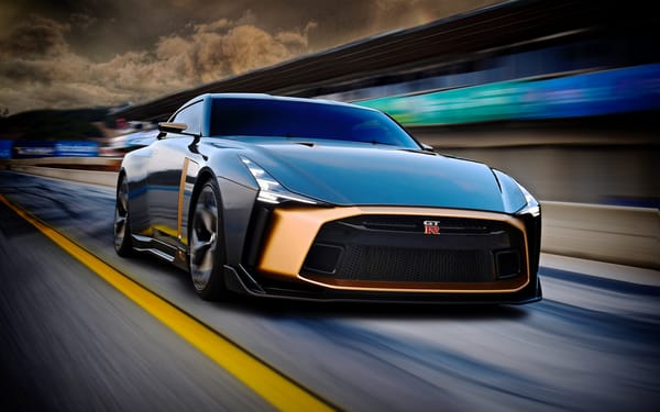 Обои Черный спортивный автомобиль Nissan GT-R50 2018 года на трассе